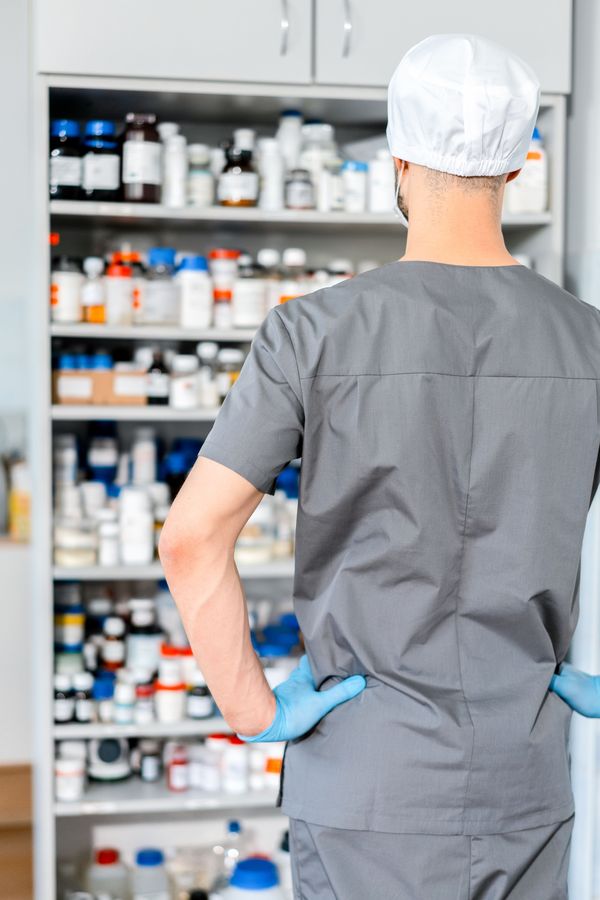 Pharmacist dispensing prescriptions at a pharmacy