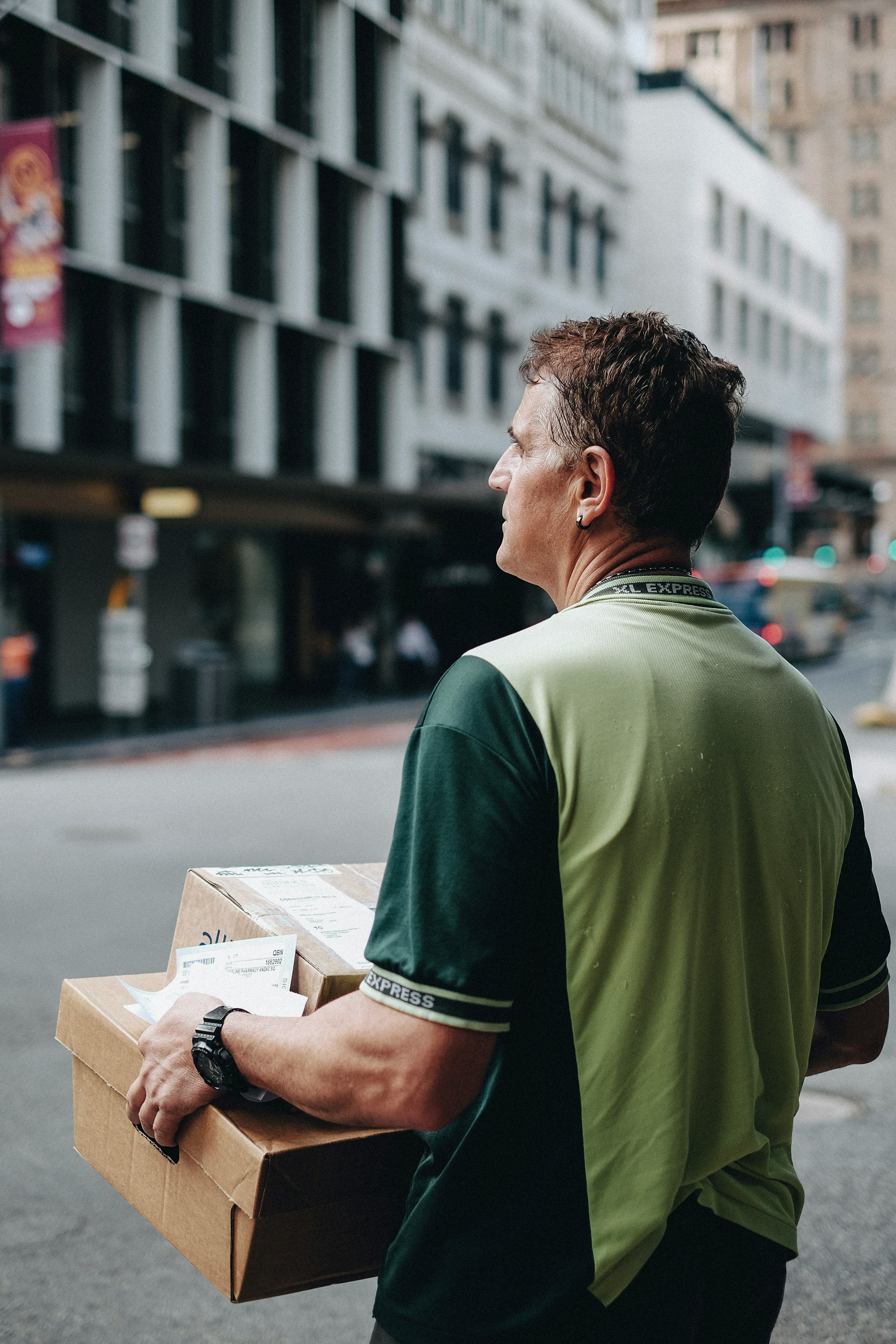 Courier delivering parcels in the city